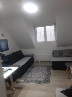 a living room with a couch and a window at Bele staze 59 in Brus