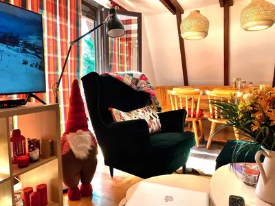 a living room with a santa hat on a chair at Kuća na Kopaoniku - Rani mraz in Kopaonik