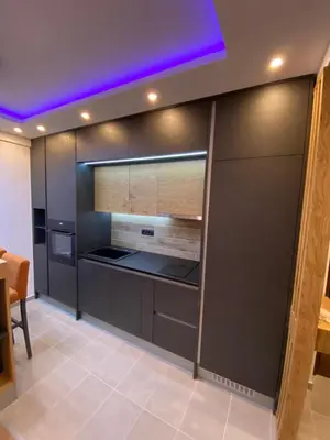 a kitchen with black cabinets and a purple ceiling at Pleasure Lux MILMARI-Kopaonik in Kopaonik
