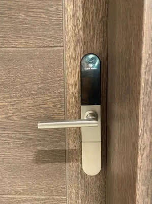a door with a cell phone sticking out of it at Apartman M&S - Zoned 2 in Kopaonik