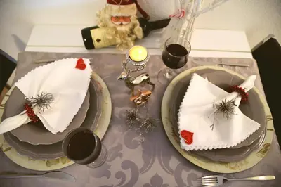 a table with two cakes on plates on a table at CIRIĆ APARTMANI in Vrnjačka Banja