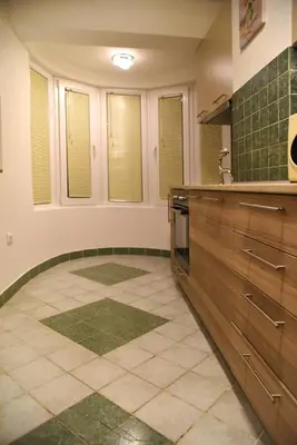 a kitchen with a sink and a tiled floor at CIRIĆ APARTMANI in Vrnjačka Banja