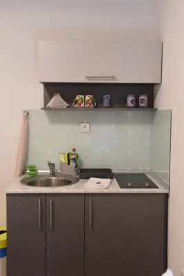 a kitchen with a sink and a counter top at CIRIĆ APARTMANI in Vrnjačka Banja