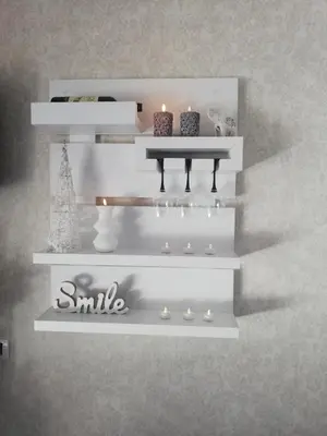 a white shelf with candles on top of it at Lux apartmani Dunja Kopaonik Čardaci - WHITE in Kopaonik