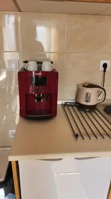 a kitchen counter with a coffee maker and a toaster at Sky Apartman 202 in Kopaonik