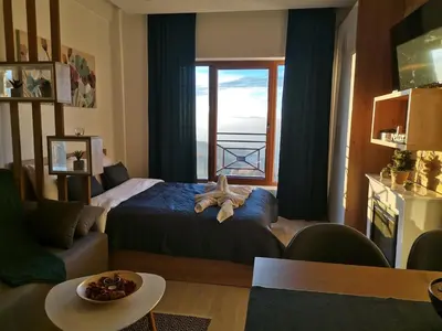 a bedroom with a bed with a teddy bear on it at SANS Lux Apartman N42 Milmari Kopaonik in Kopaonik