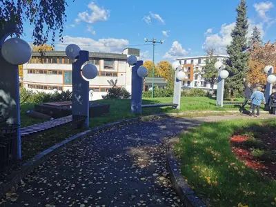 a park in front of a building at Apartment Ornament Lux in Vrnjačka Banja