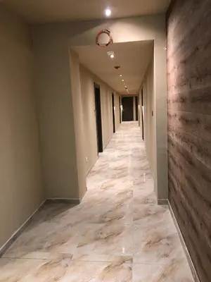 a hallway of an empty room with wooden floors at Apartman Kraljevi čardaci Makica Kopaonik sa garazom in Kopaonik