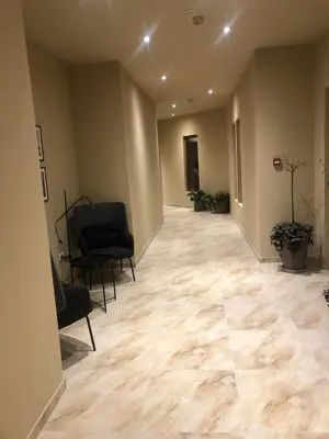 an empty hallway with chairs and a waiting room at Apartman Kraljevi čardaci Makica Kopaonik sa garazom in Kopaonik