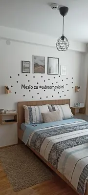 a bedroom with a large bed in a room at Apartman MonTanja Kopaonik, u hotelu Kraljevi Čardaci in Kopaonik