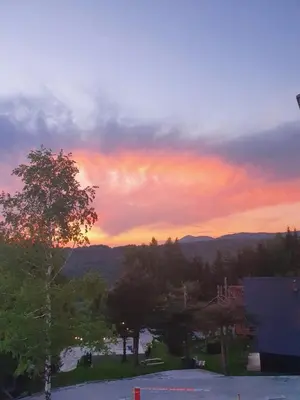 a view of a sunset from a parking lot at Apartman Lucky 2 Kopaonik in Kopaonik