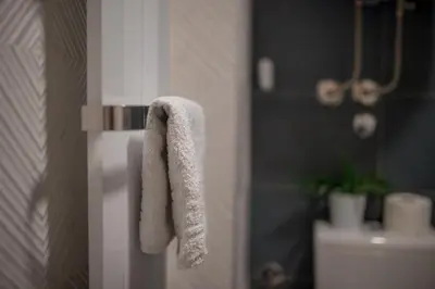 a towel hanging on the side of a refrigerator at MIR i LIRA apartmani Kopaonik in Kopaonik