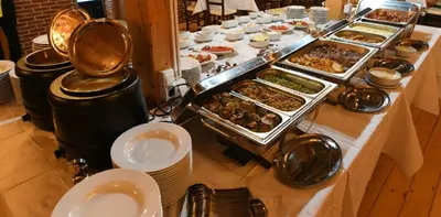 a buffet with many different types of food on a table at Lola Apartment - Župa, Kopaonik in Kopaonik