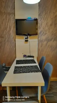 a table with a keyboard and a computer monitor on it at S Konaci in Kopaonik