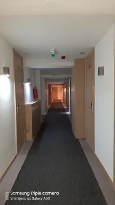 a hallway of an office building with a long corridor at S Konaci in Kopaonik