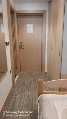 a hallway with a door in a hospital room at S Konaci in Kopaonik