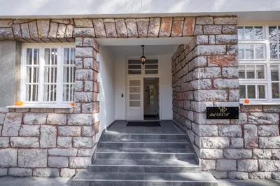 a brick entryway to a home with a stone wall at Vila Greta by Hotel Ramonda in Rtanj