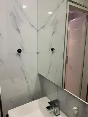 a white bathroom with a sink and a mirror at Aleksinac in Aleksinac