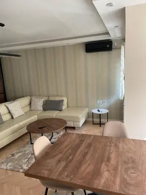 a living room with a couch and a table at Aleksinac in Aleksinac