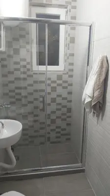 a bathroom with a shower and a sink at Apartman Pavlovic in Leskovac
