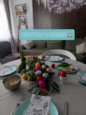 a table with a centerpiece of fruits and vegetables on it at Pogled iznad oblaka in Kopaonik