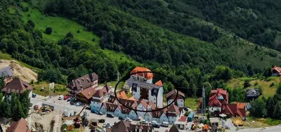 an aerial view of a town in a mountain at Pogled iznad oblaka in Kopaonik