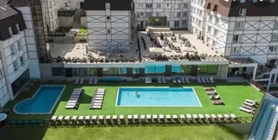 an aerial view of a large building with a swimming pool at Kraljevi Cardaci Olja in Kopaonik