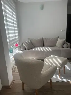 a living room with a couch and a chair at Kraljevi Cardaci Olja in Kopaonik