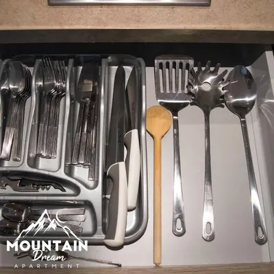 a drawer filled with utensils in a drawer at Fully Equiped, Quiet, for 5 persons, Next To Panoramic Gondola in Brzeće