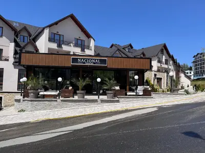 a building on the side of a street at Milmari P74, Quest apartmani, Kopaonik in Kopaonik