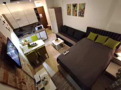 an overhead view of a living room with a large bed at Milmari P74, Quest apartmani, Kopaonik in Kopaonik