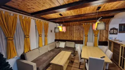 a living room with a couch and a table at Ski House in Kopaonik