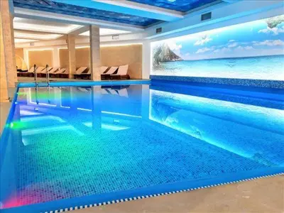 a swimming pool in a hotel with a view of the ocean at Milmari N 79 in Kopaonik