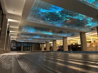 an empty mall with a star system painted on the ceiling at Milmari N 79 in Kopaonik