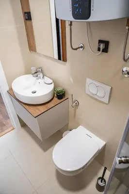 a bathroom with a white toilet and a sink at Mountain Chalet Kopaonik in Kopaonik