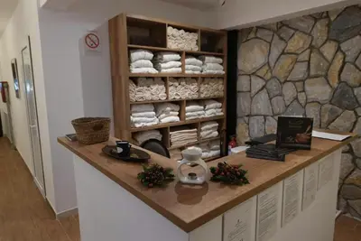 a kitchen with a counter with a shelf of towels at Apartman Gvozdac, Župa - Kopaonik in Kopaonik
