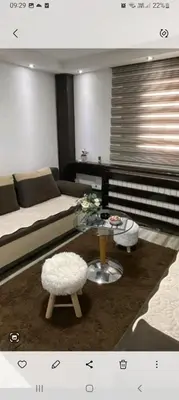 a living room with a bed and a coffee table at ANASTASIJAKOP in Kopaonik