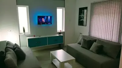 a living room with a couch and a table at Apartman Ivanovic 6 Sokobanja in Soko Banja