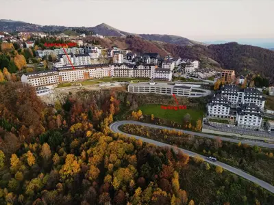 an aerial view of a city with buildings and a road at Milmari - Apartman N85 in Kopaonik