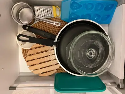 a pot on a rack in a kitchen with utensils at Ivkovic spa Milmari N16 in Kopaonik