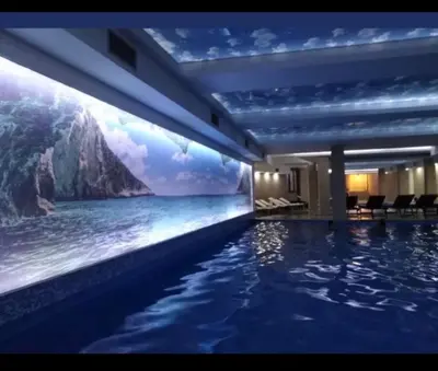 a hotel swimming pool with a view of the ocean at Kopaonik apartmani NR in Kopaonik