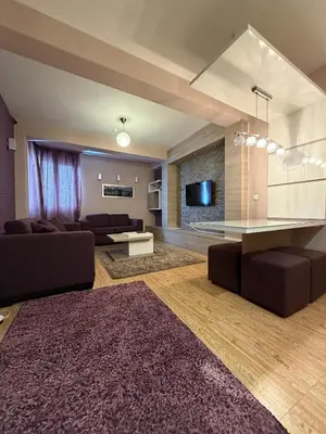 a living room with a couch and a table at Mujen Lux Tutic - Free Spa & Wellness in Kopaonik