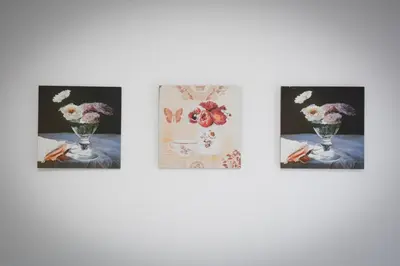 a group of four pictures of flowers in vases at Apartman Nikolina in Vrnjačka Banja