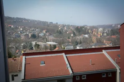 a view of a city with houses and roofs at Apartman Nikolina in Vrnjačka Banja