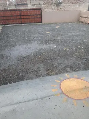 aphalt street with a manhole cover on the ground at Seosko turističko domaćinstvo Stojković in Aleksinac