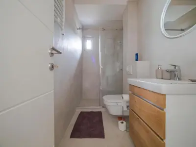 a bathroom with a sink and a toilet and a shower at Apartmani Šišarka in Kopaonik