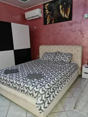 a bedroom with a bed in a room at Apartman -HARMONY- in Paraćin