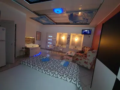a living room with a bed and a couch at Apartman -HARMONY- in Paraćin