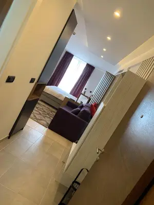 a living room with a couch and a window at Apartman Enjoy N82 Milmari&spa in Kopaonik