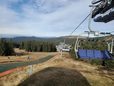 a gondola ride at the top of a mountain at SkyKop Apartman L21 in Kopaonik